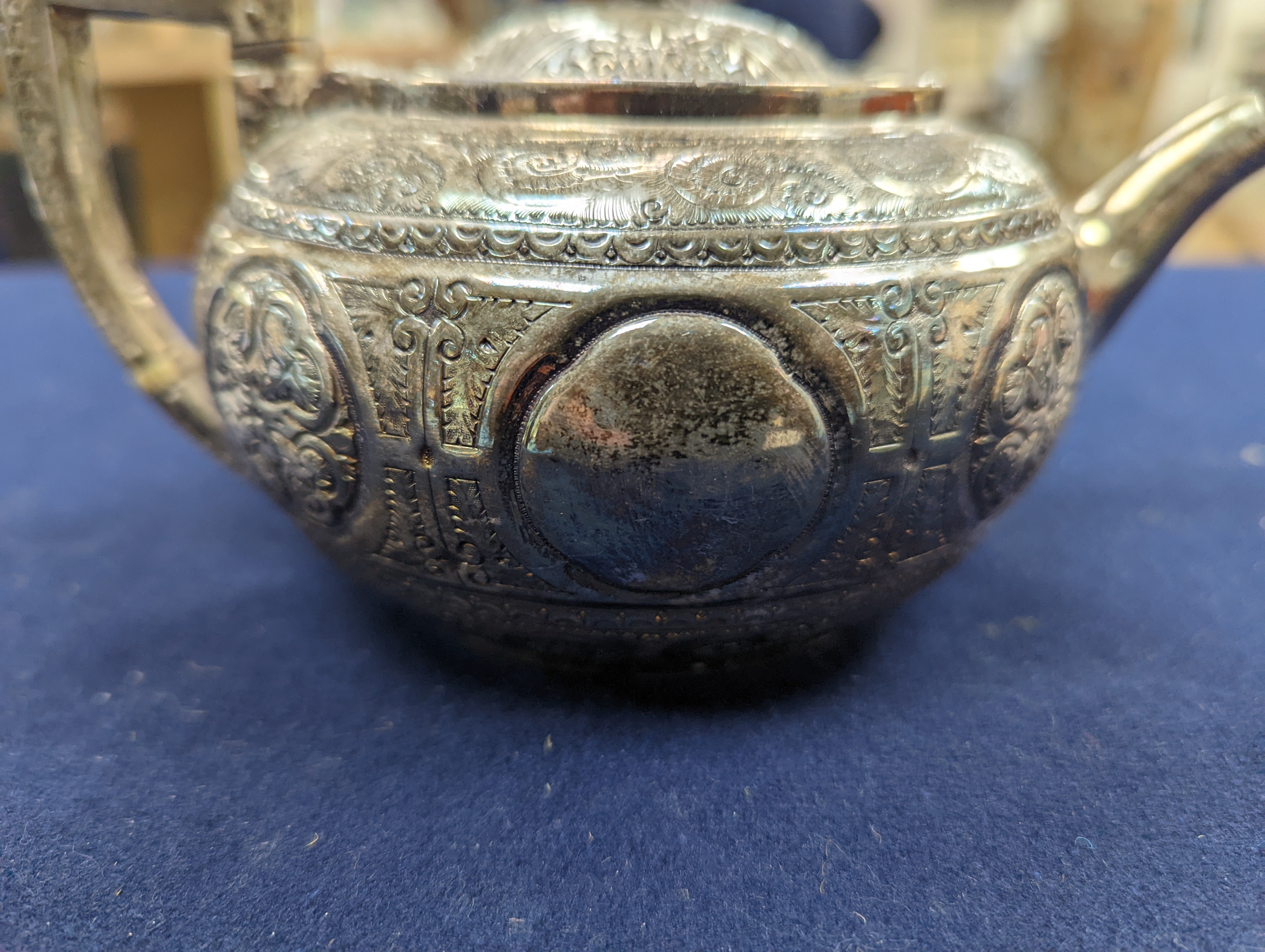A WMF dish, Islamic white metal mounted photo album and a plated teapot and jug